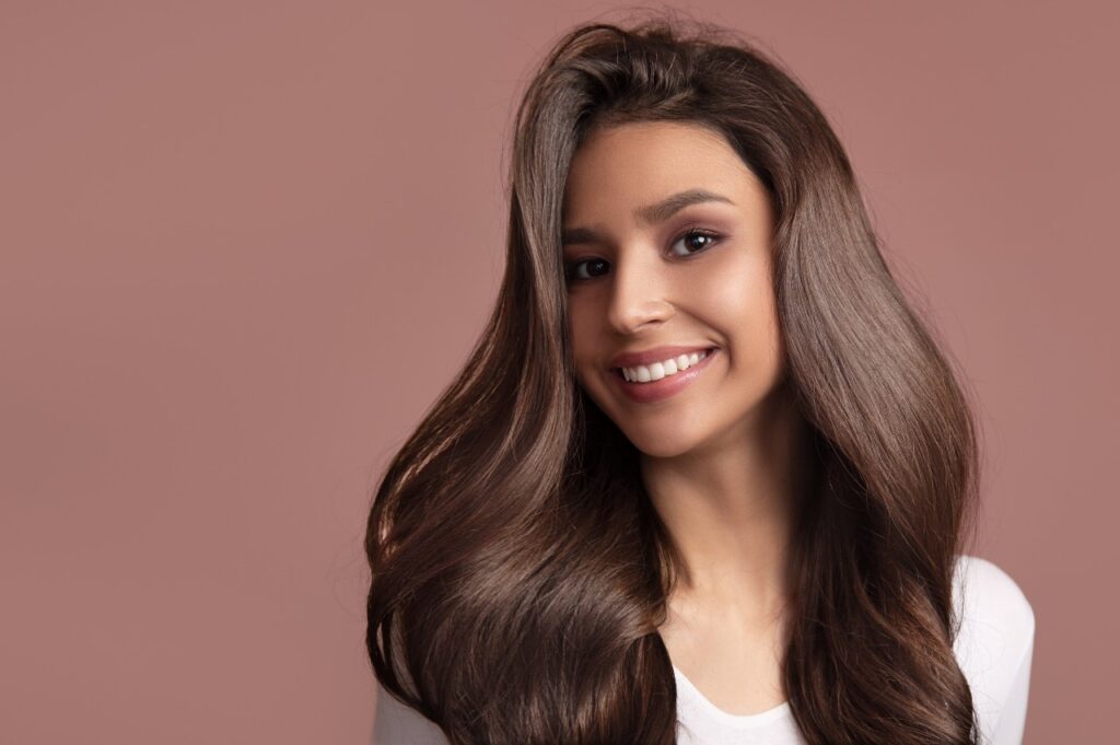 Portrait of a woman with luxurious hair and a beautiful smile